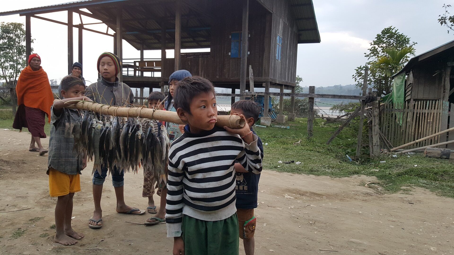 Kids selling fish Chindwin River Myanmar