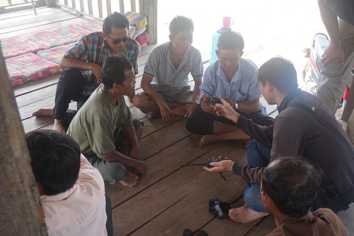 Showing walkie talkies to enforcement team in Kengmeaw